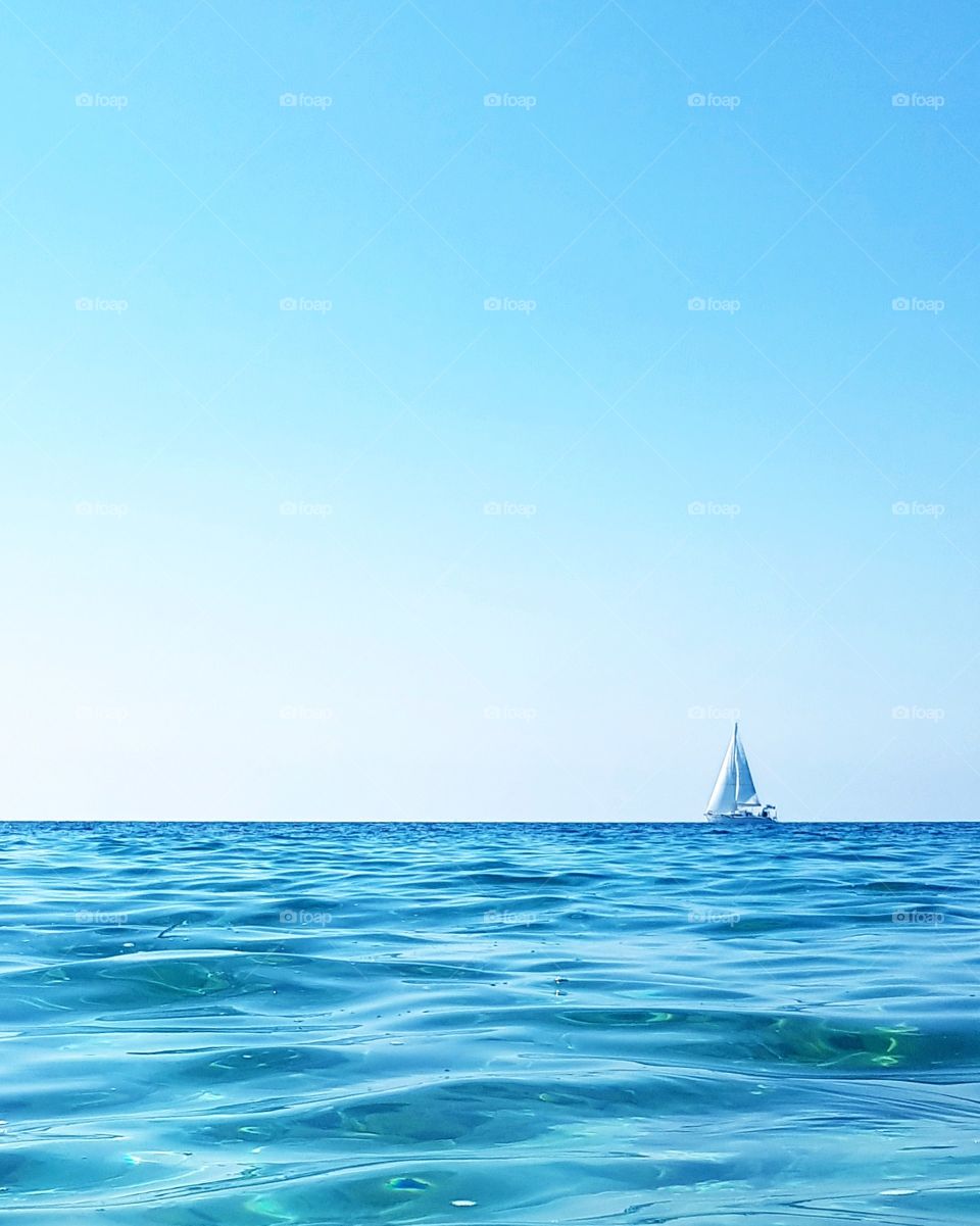 Yacht sailing through the sea.