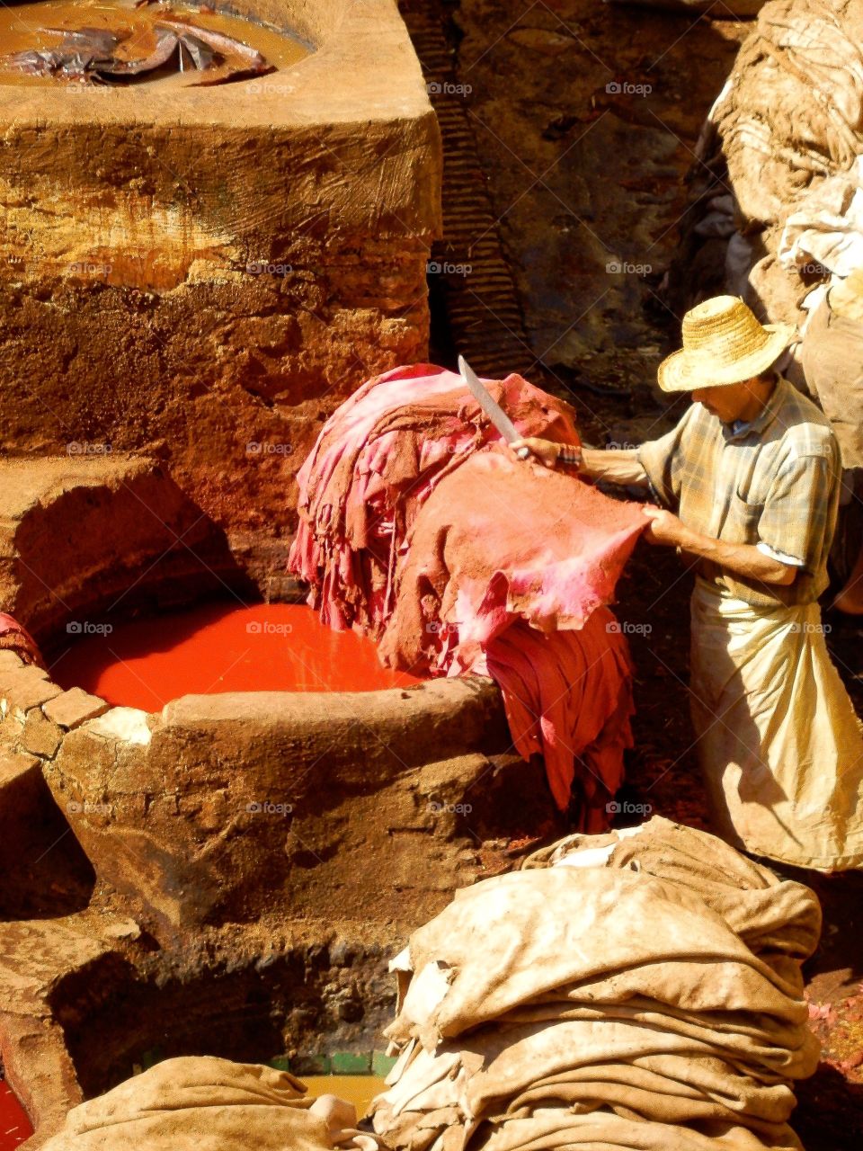 Hard work in painting leather.