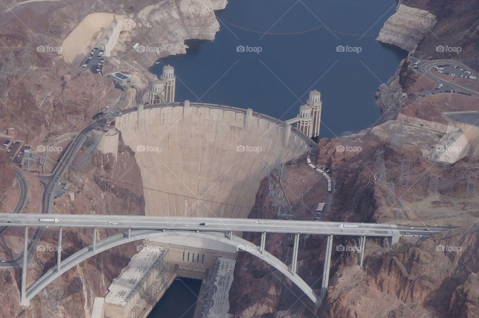 Bridge and Hoover Dam view from helicopter flying above