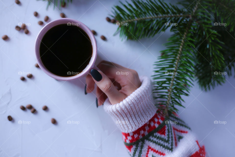Cup of coffee and Christmas tree branches 