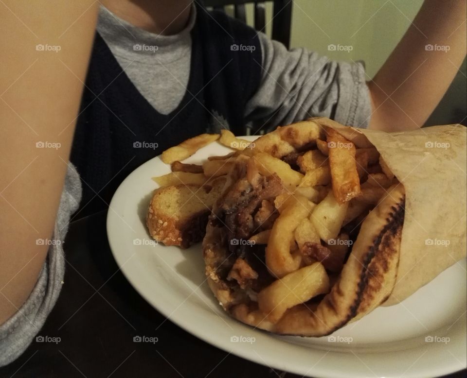 pita gyros in front of a child