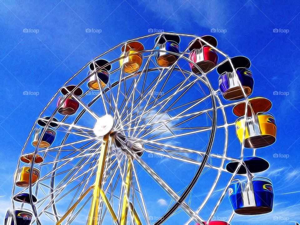 Ferris wheel against blue sky