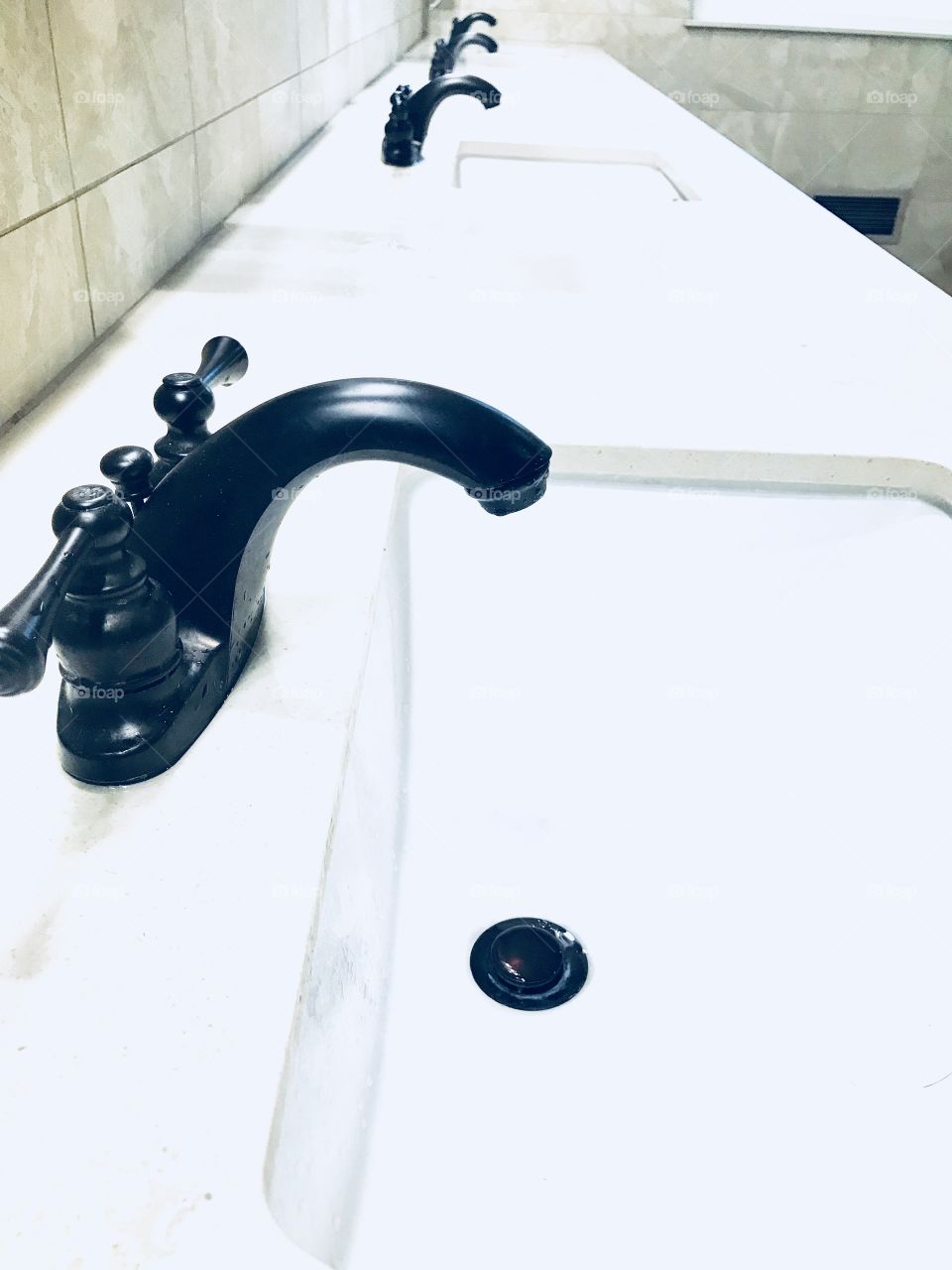 The multiple sinks of the church bathroom. 