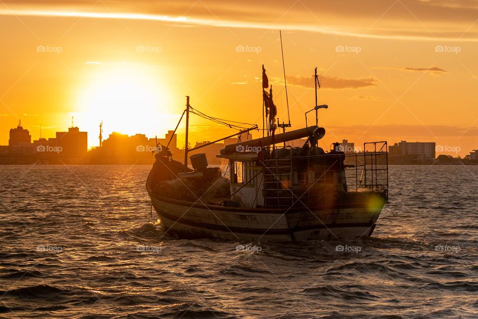 Fishing boat at sunset.