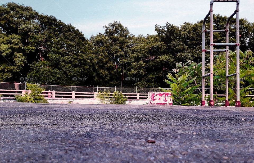 Ground level view of abandoned pool