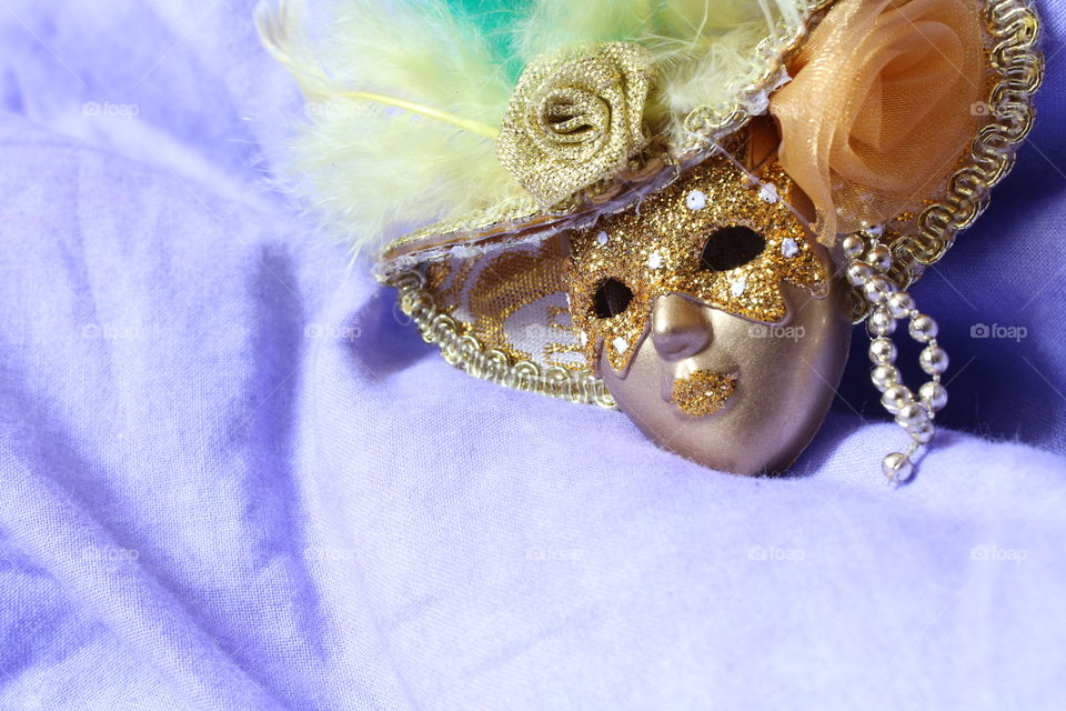 miniature toy mask on textile material