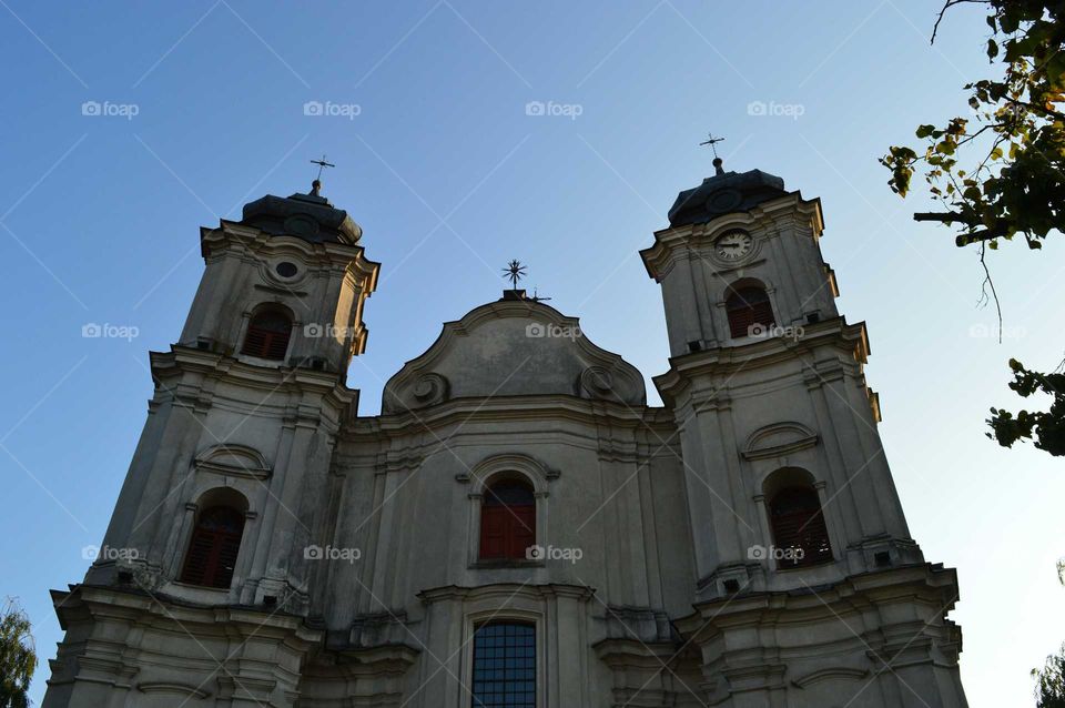 Clear blue sky above the historic basilica in Poland