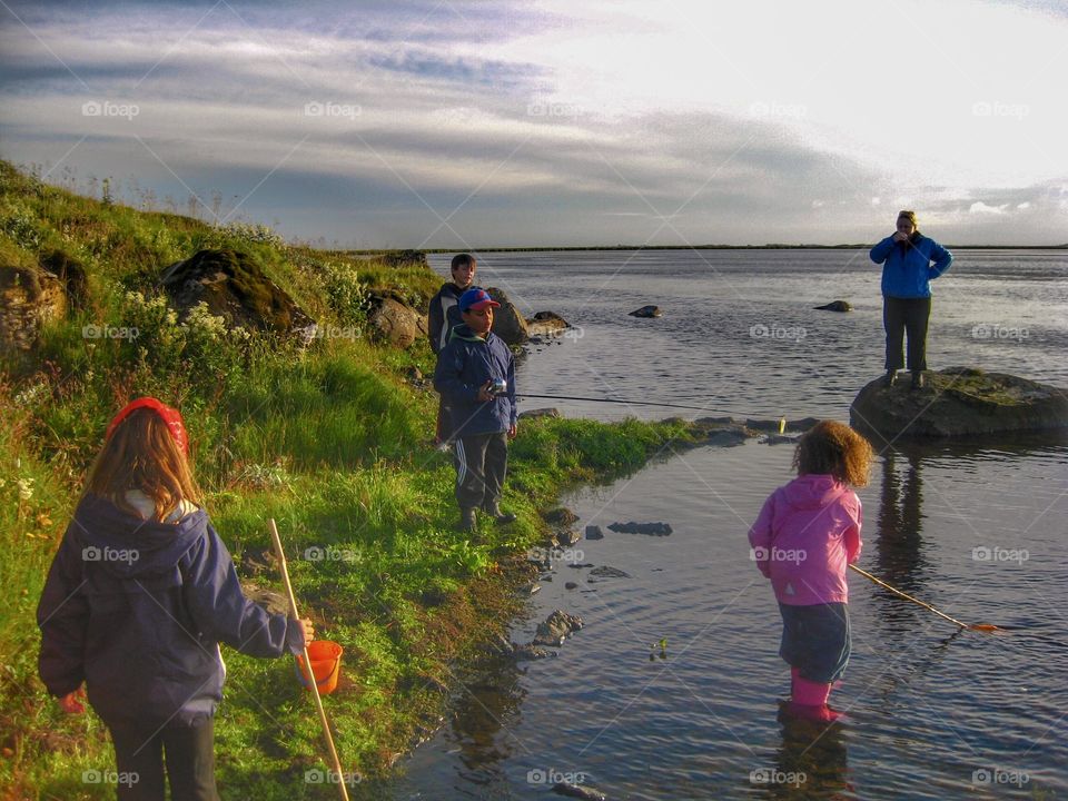 Having fun lakeside getting ready to do some fishing.   Something every kid should try.  It’s a lesson in patience and appreciation of nature.