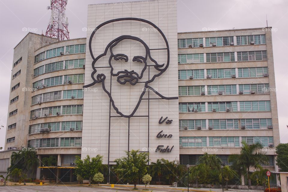 One of the buildings in Plaza de la Revolution (Havana Cuba) featuring the steel memorial illustration of Fidel  Castro's face .