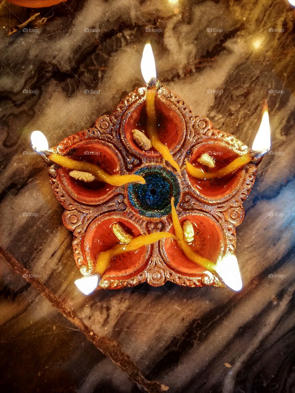 Multiple lights from one Diya; same as our life, so keep shining.