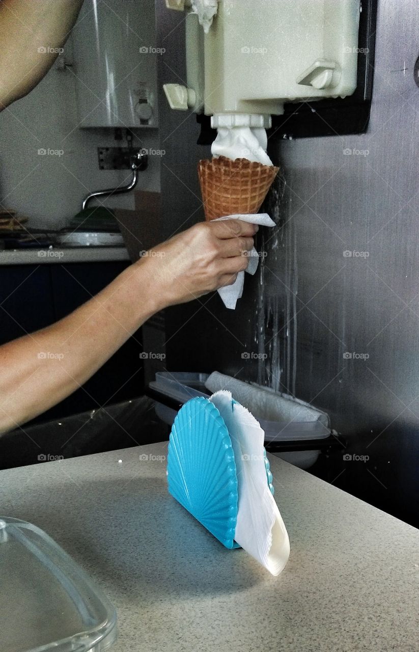 Hand holding ice cream. Hand holding ice cream