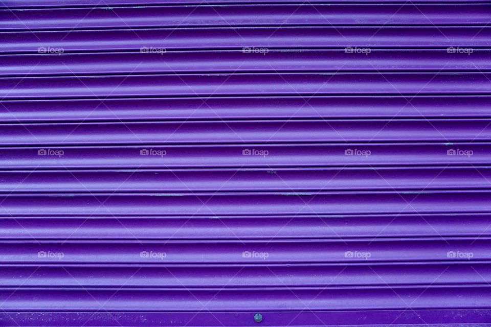 Purple Shutters

Walking to the train station I noticed these purple shutters on a shop window.....