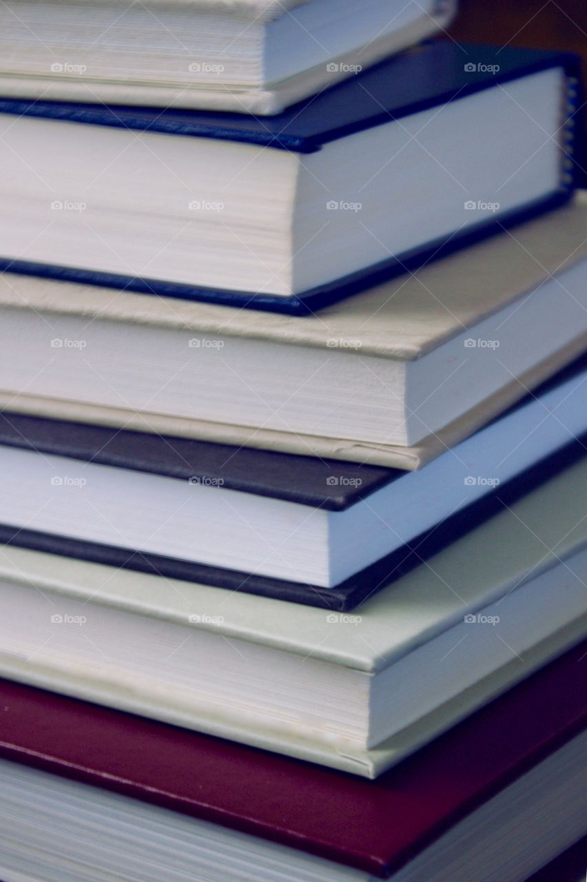 Closeup of a stack of books with plain covers