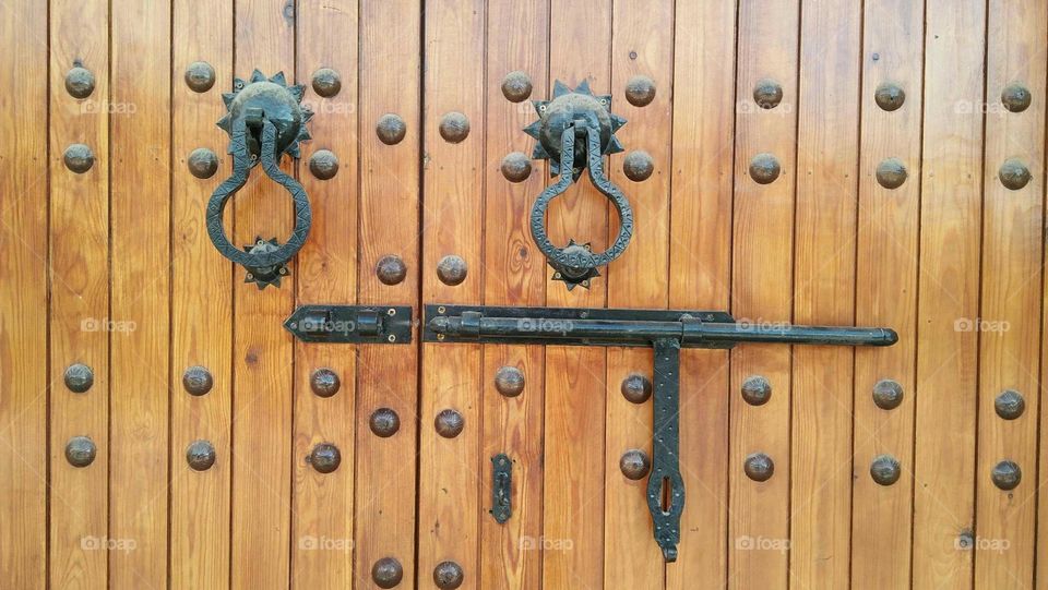 Traditional moroccan door made of wood and metal.