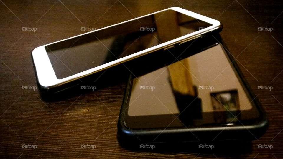 two cell phones on the table