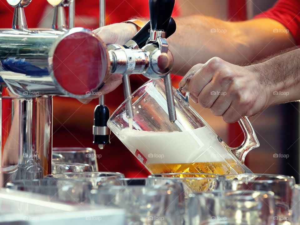 Bartender pouring beer