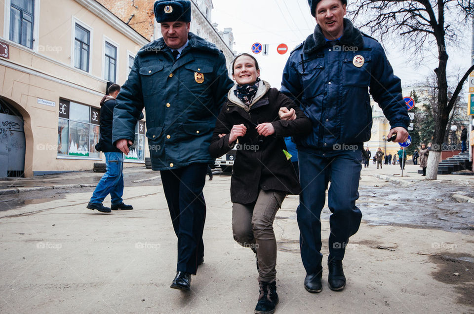 Smiling while arrest by the police