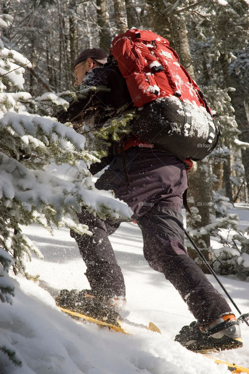 Snowshoeing up a mountain in the White Mountains of New Hampshire