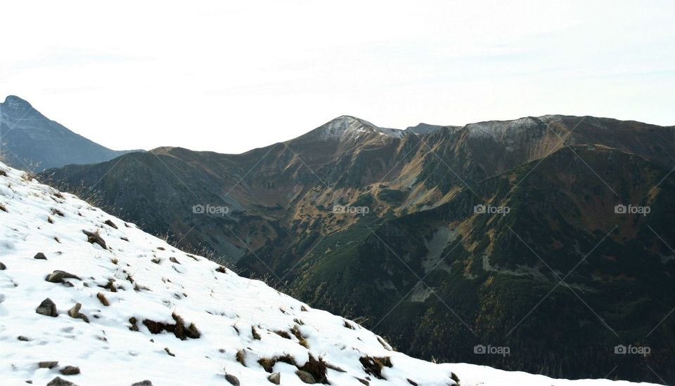 Nice autumn in mountains with snow