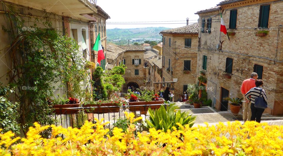 Spring in an ancient town. Flowers,people and funny spring in an ancient town of Marche,Italy