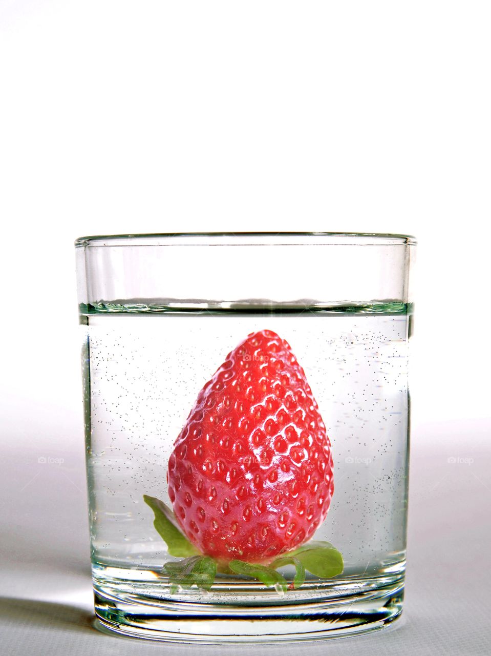 a strawberry in the glass