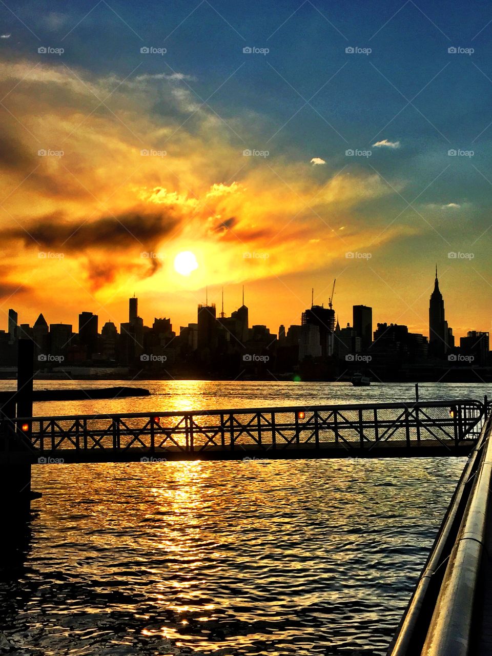 New York City skyline. Sunrise on the Hudson River.. New York City skyline. Sunrise on the Hudson River. iPhone photo.