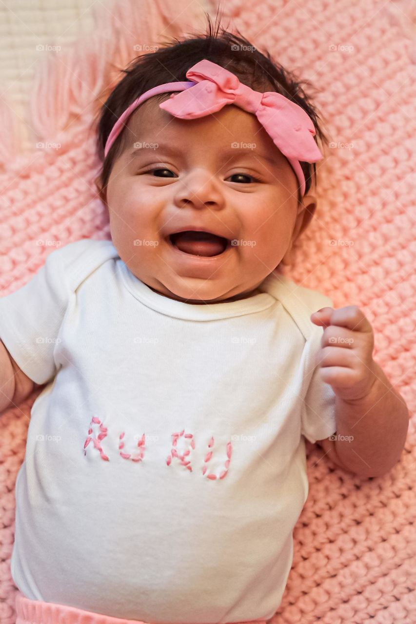 Barbie style baby, baby dressed in pink with pink blanket, happy baby in pink 