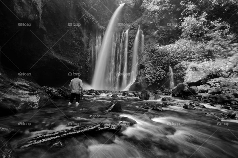 Amazing fine art black and white Tiu Kelep Waterfall near Rinjani, Senaru Lombok indonesia. Southeast Asia. Motion blur and soft focus due to Long Exposure Shot.