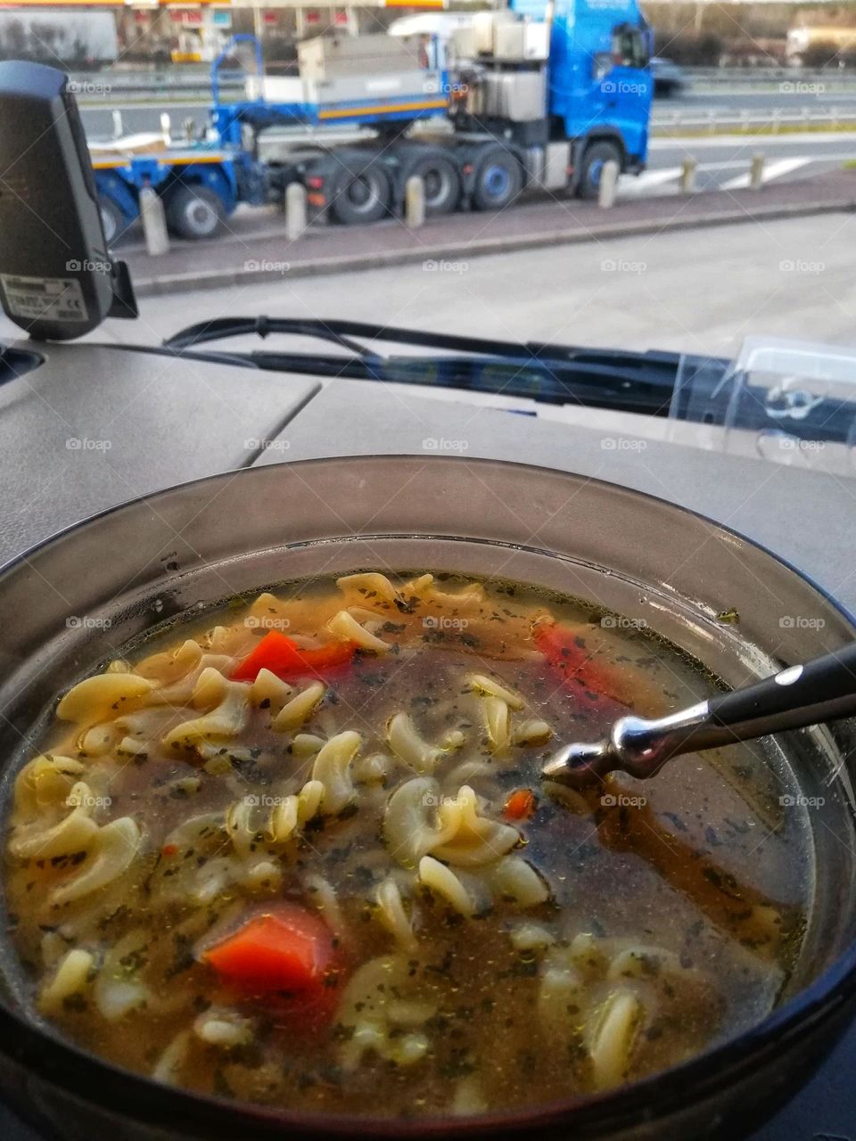 Warm broth for lunch during break in the international transport. Trucking food.