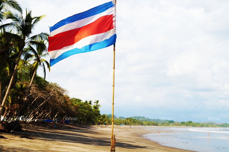 Scenic view of flag on beach