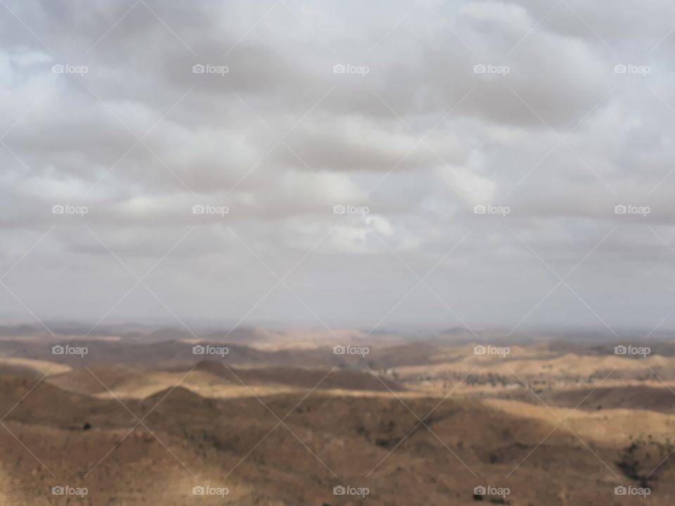 grey sky over golden desert