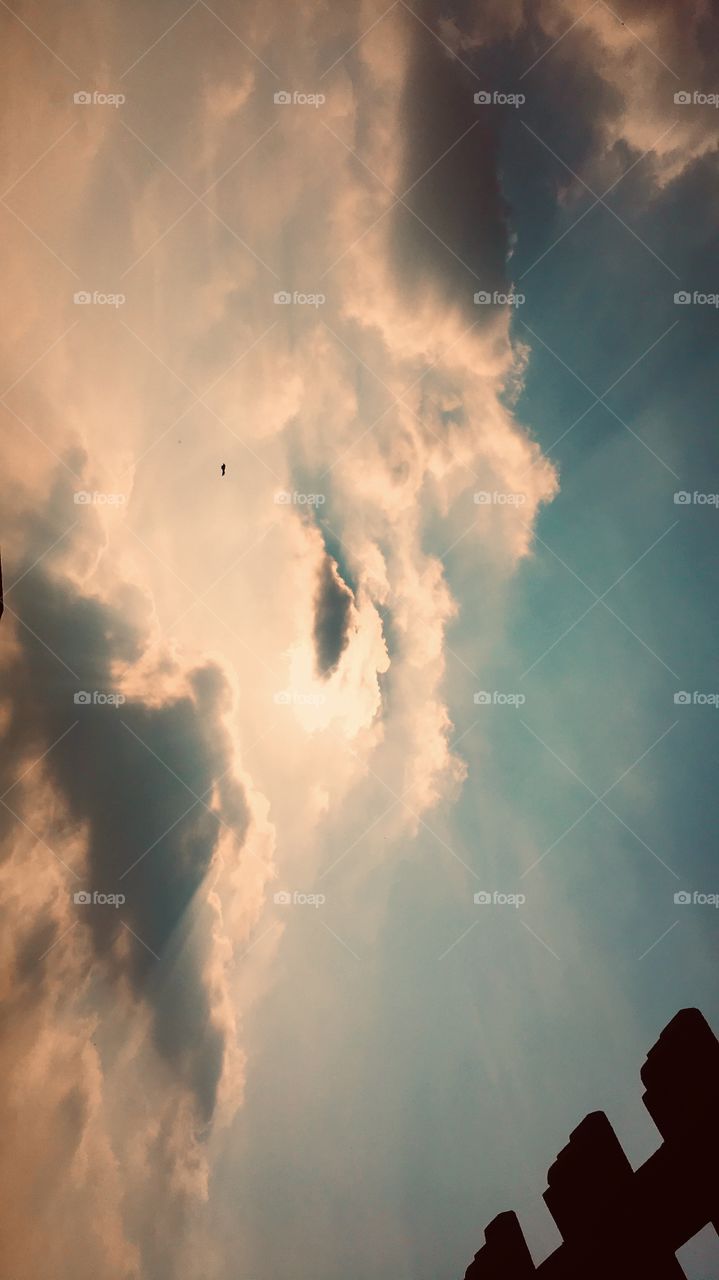 The sun and sky looks amazing.It shines like a diamond in the sky 