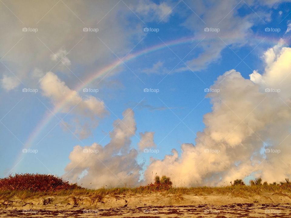 Looking for a pot of gold. Rainbow. Dunes. Beach life.  
