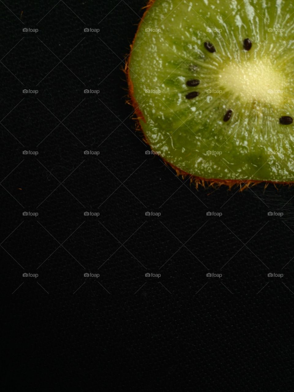 Kiwi isolated in black background 