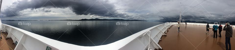 Alaskan landscape with clouds of the deck of a cruise ship 