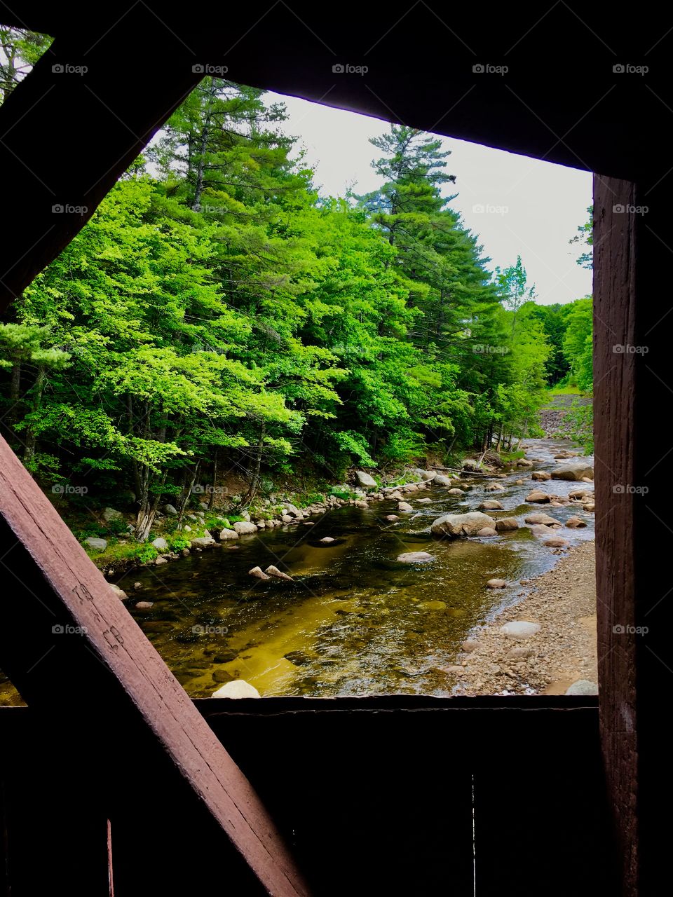 Looking out the window of The Conway New Hampshire Covered Bridge