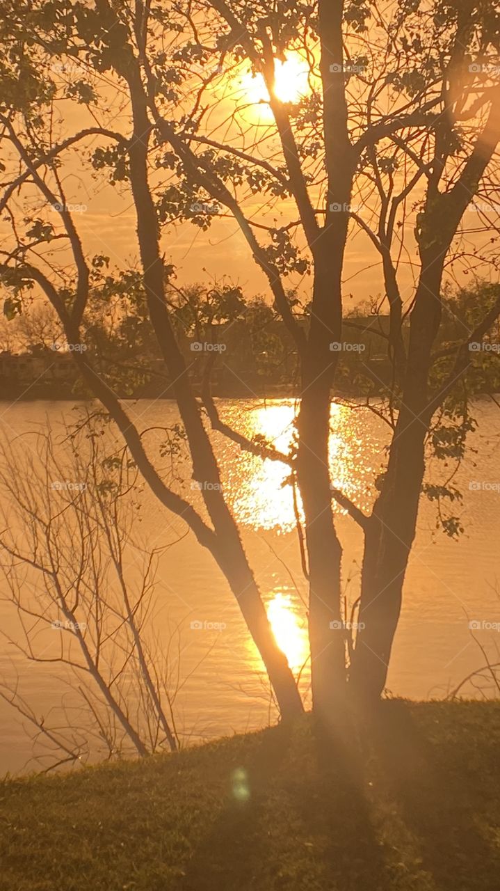 Early evening sunset with 2 separate Reflections on Lake Waters. Evening colors present but lots of clouds also present. So so for good sunset pics.