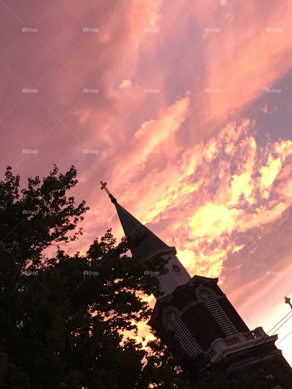 Sunset surrounding the church steeple