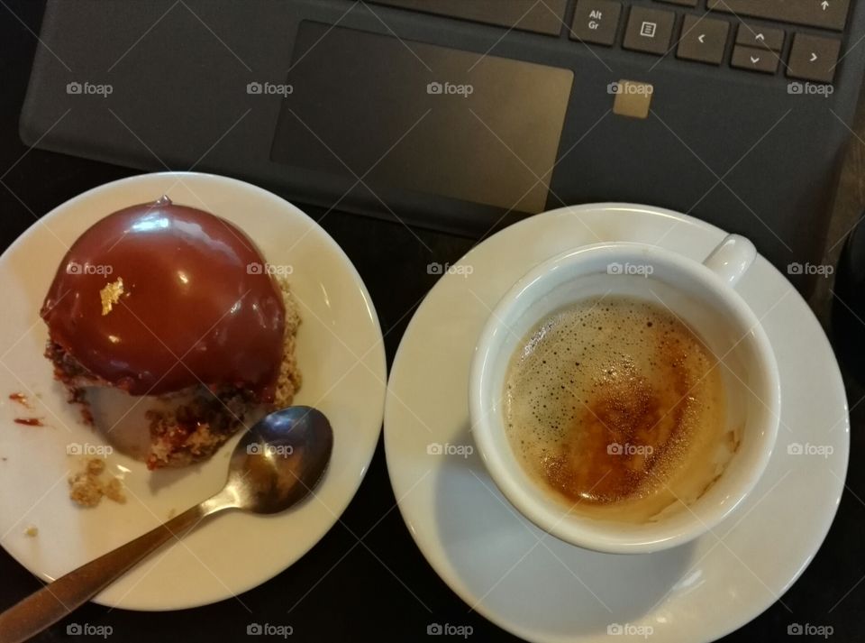having coffee and sweet in front of surface tablet keyboard