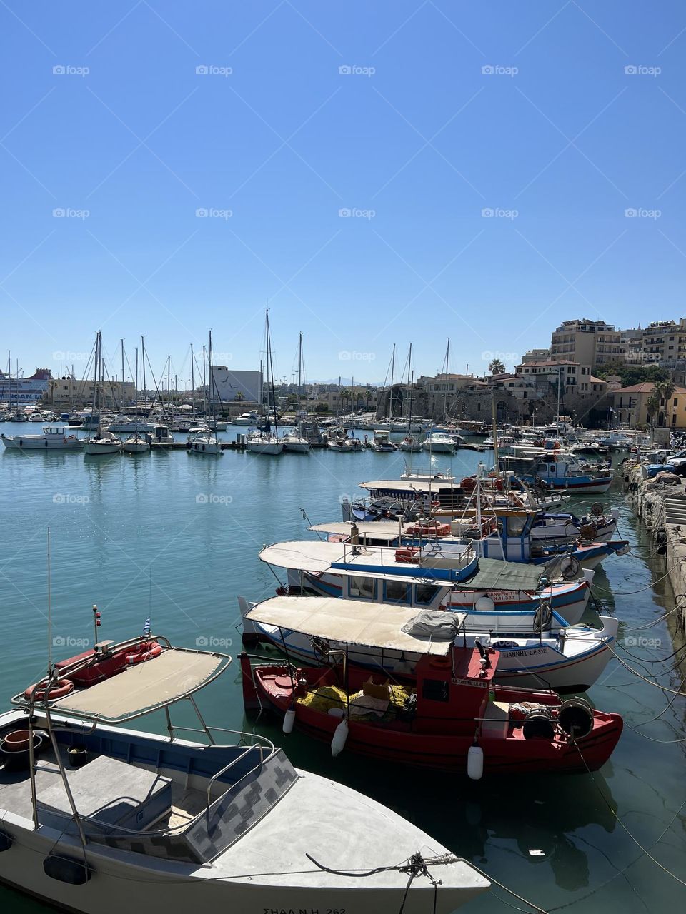 Little Boats on row in the pier 
