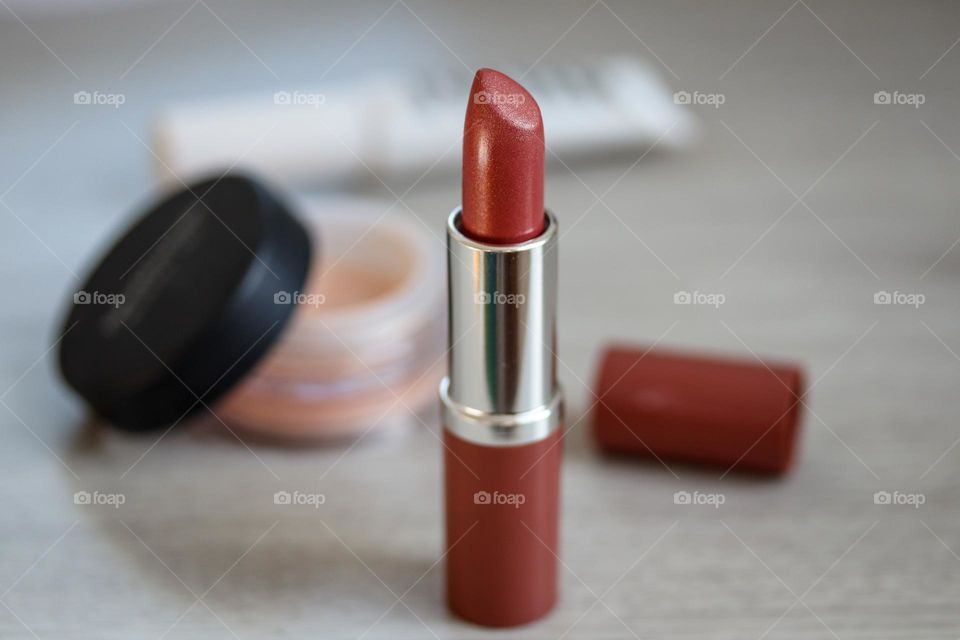 Beauty products: terracotta color lipstick