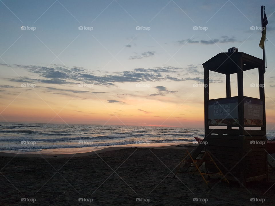 Tuscany beach at sunset in summer