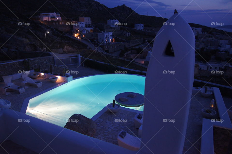 Nighttime infinity pool - Villa pool lit at night taken from the second floor balcony.   Mykonos, Greece.