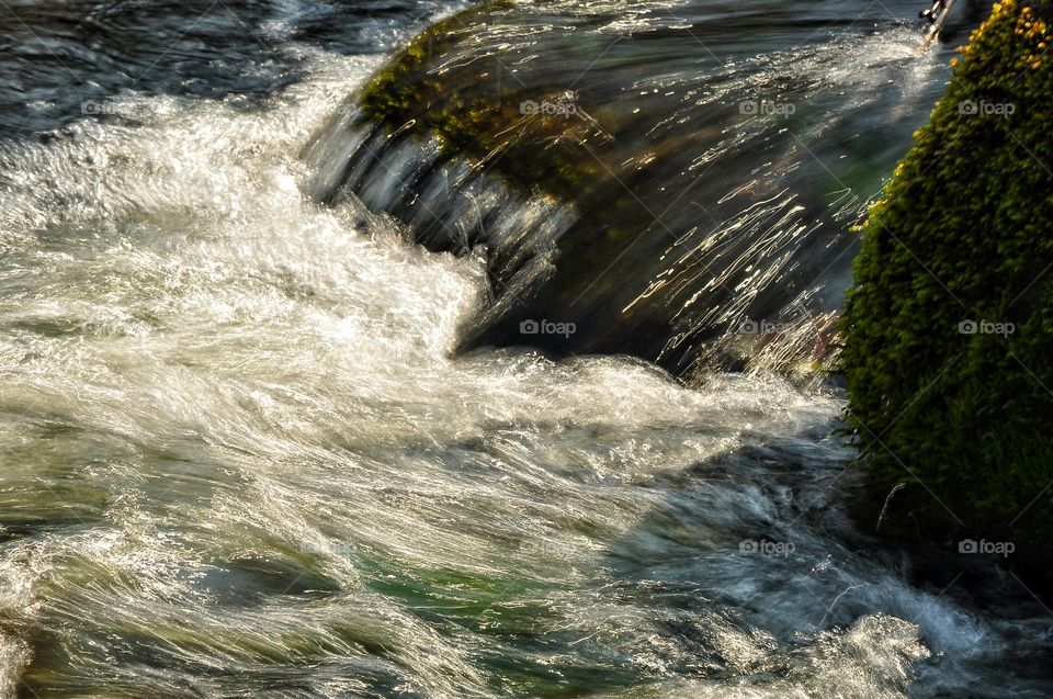 waterfall and river in park in Poland