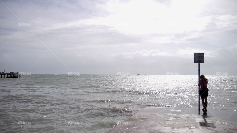 A woman Enjoying the beach view in Key West Florida 