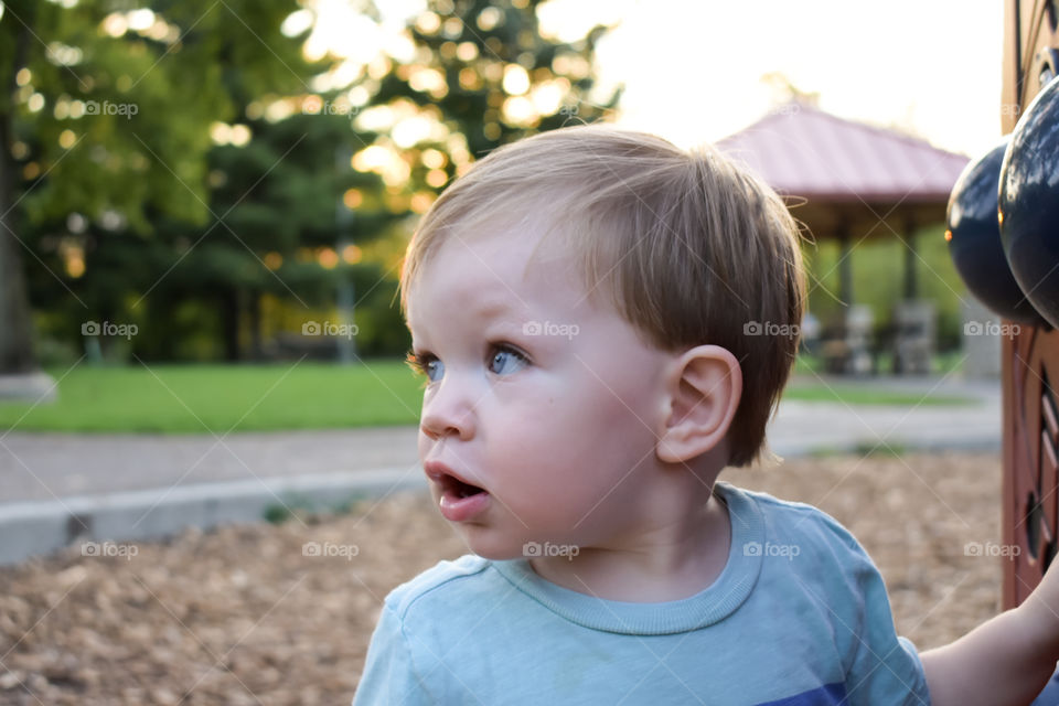 Cute curious toddler on playground 2