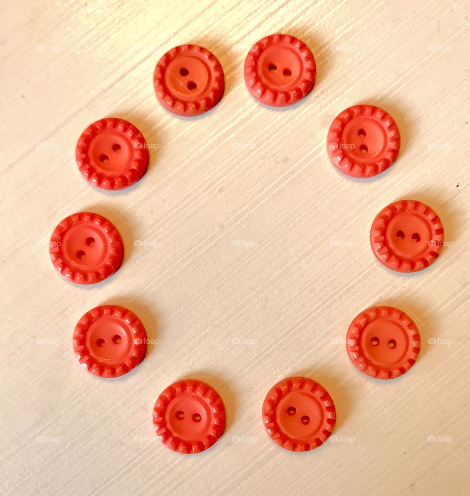 Circle of Orange Buttons