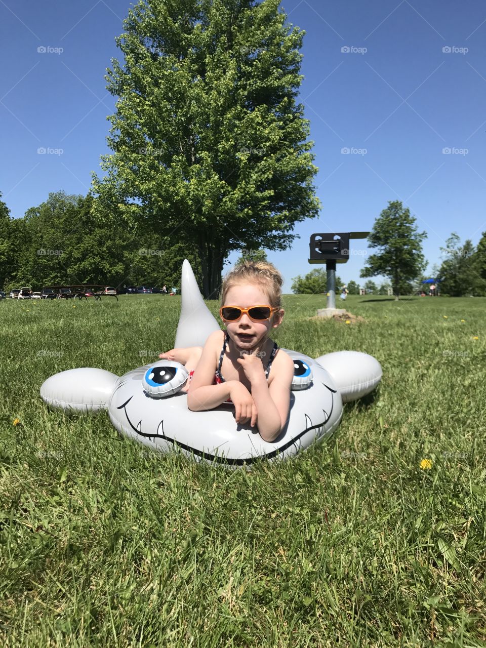 Girls just wanna have fun! Mila posing on her shark 