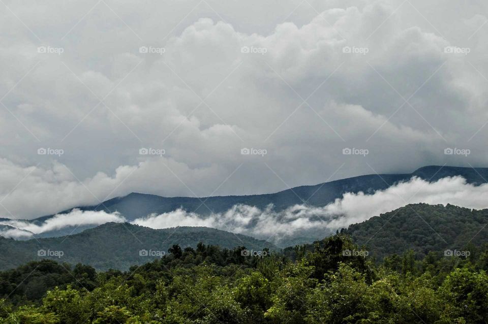 Clouds laying on the Mountain Top