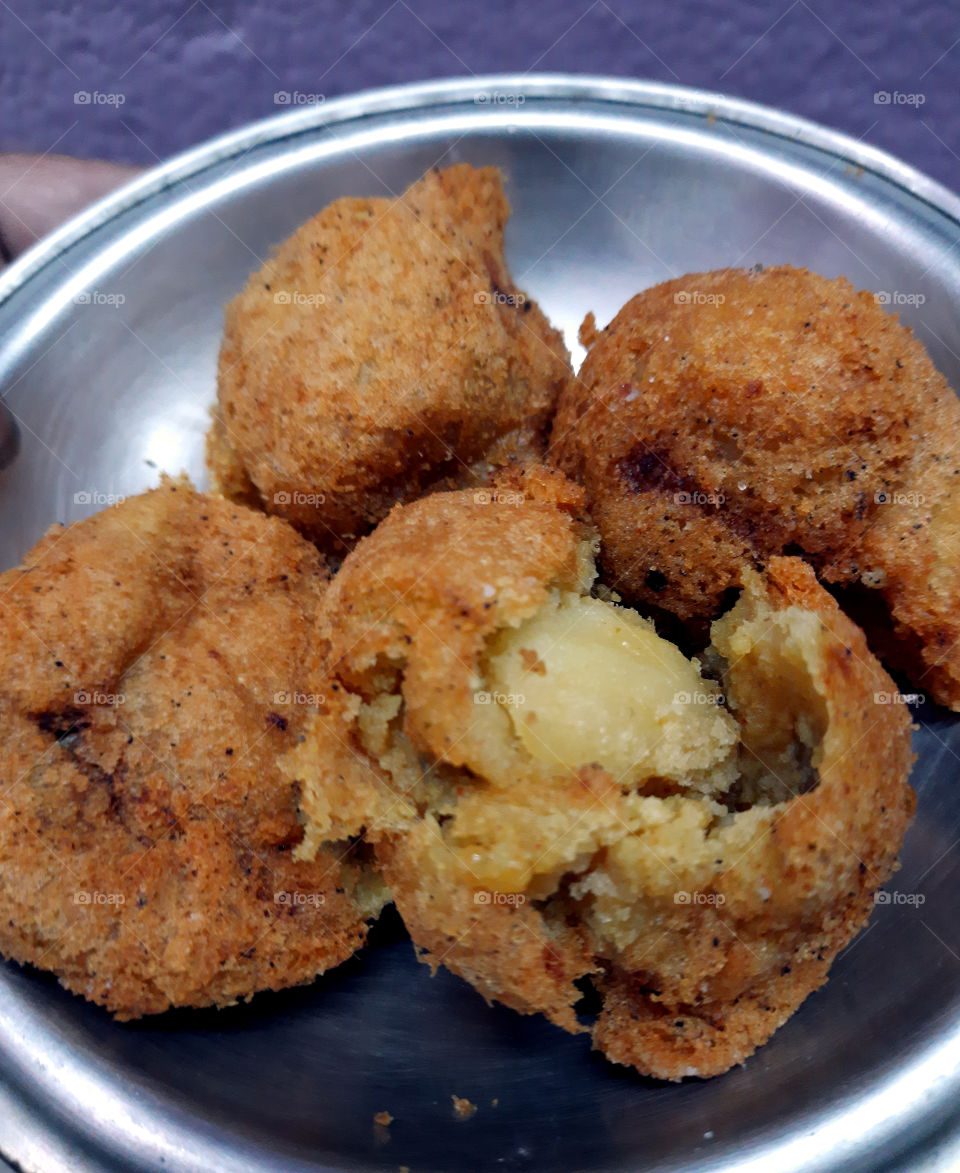 "Aloor Chop" Or Potato fritters/Croquettes is Bengal's most popular street snacks.A very cheap but tasty, easy available Street Food.“Aloo Bonda”, or “Batata Vada”, these are similar in the preparation and the ingredients vary depending on locality.